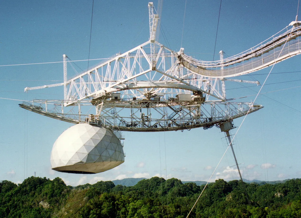 Arecibo Observatory's suspended platforms became world famous following their appearance in the film Goldeneye. Credit: NSF / University of Central Florida