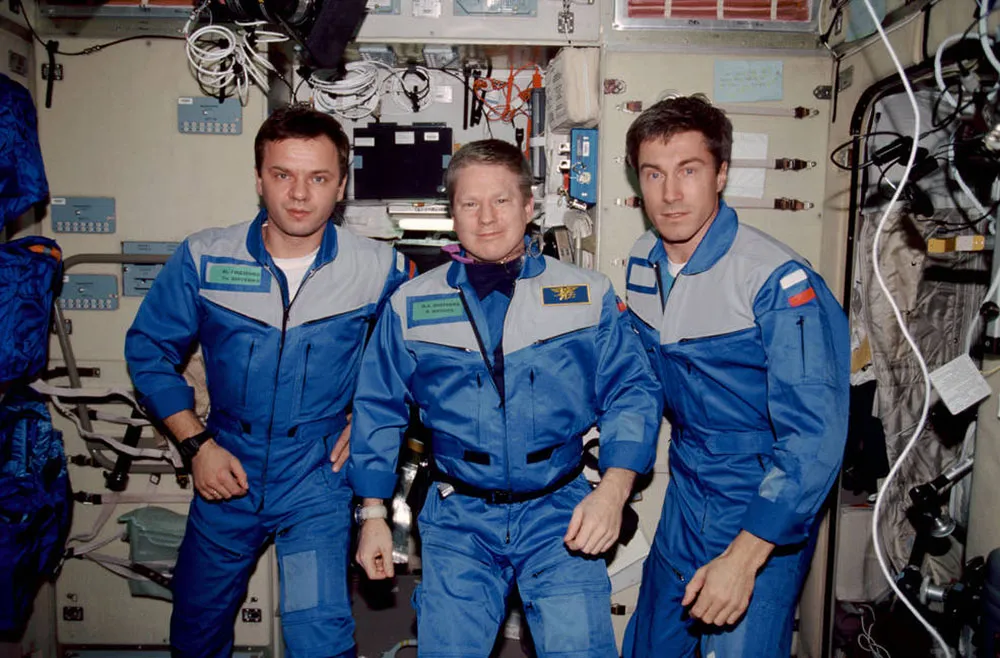 International Space Station Expedition 1 crew, 1 month into their mission. Left to right: Yuri P. Gidzenko, William M. Shepherd, Sergei K. Krikalev. Credit: NASA