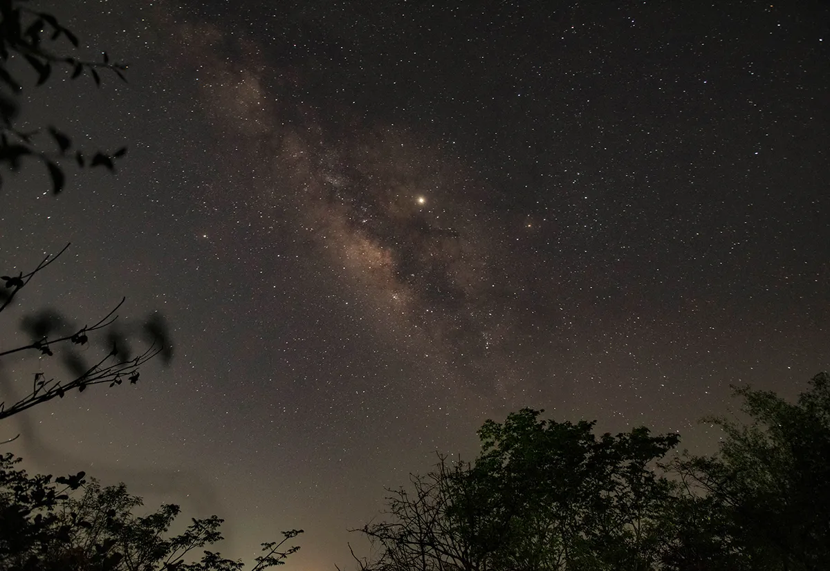Jupiter (the bright spot in the centre) appears near Saturn (8 o'clock of Jupiter) against the backdrop of the Milky Way, Pune, India, 5 May 2019. Credit: Pratham Gokhale/Hindustan Times via Getty Images