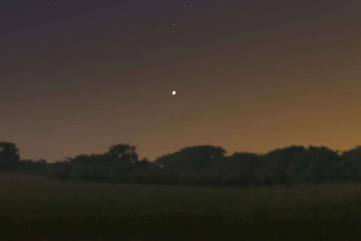 A computer-generated view of Jupiter and Saturn as they will appear in the night sky over the southwest of England on 21 December 2020. This view is looking towards the south west at about 5pm UTC. Credit: Stellarium