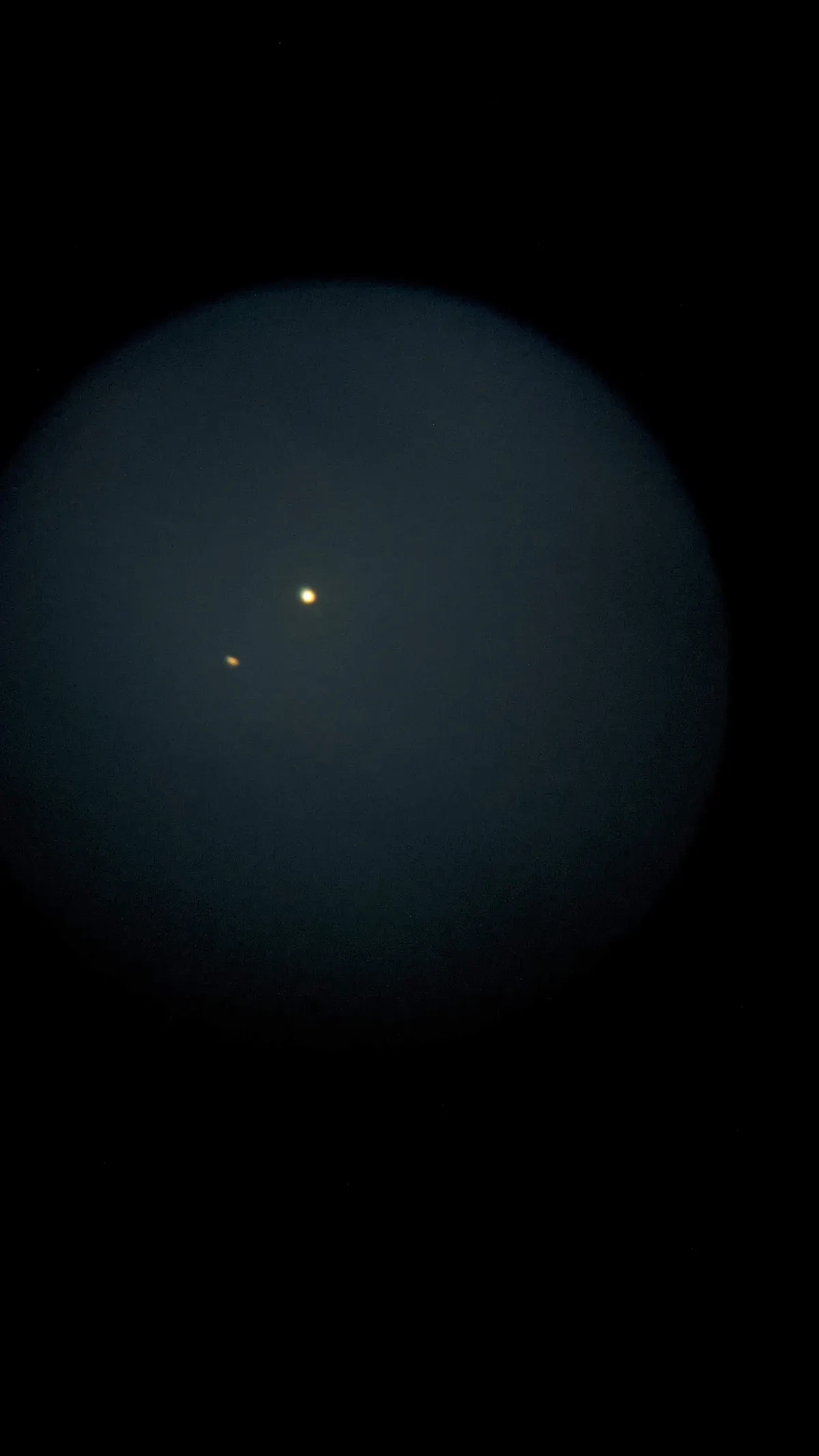 A family photo of the conjunction! Simon Cochrane took this photo with his son's Celestron Firstscope and a smartphone. Credit: Simon Cochrane.