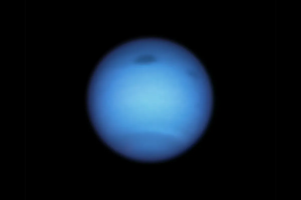 A dark storm spotted on Neptune by the Hubble Space Telescope. Credit: NASA, ESA, STScI, M.H. Wong (University of California, Berkeley) and L.A. Sromovsky and P.M. Fry (University of Wisconsin-Madison)