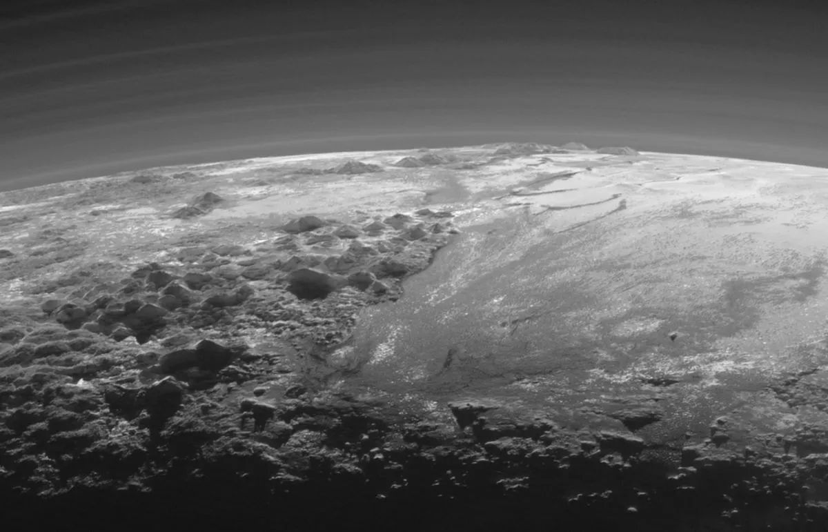 A view of icy mountains and ice plains on Pluto, captured by New Horizons just 15 minutes after its closest approach to Pluto on 14 July 2015 as the spacecraft looked back towards the Sun. Credit: NASA/Johns Hopkins University Applied Physics Laboratory/Southwest Research Institute
