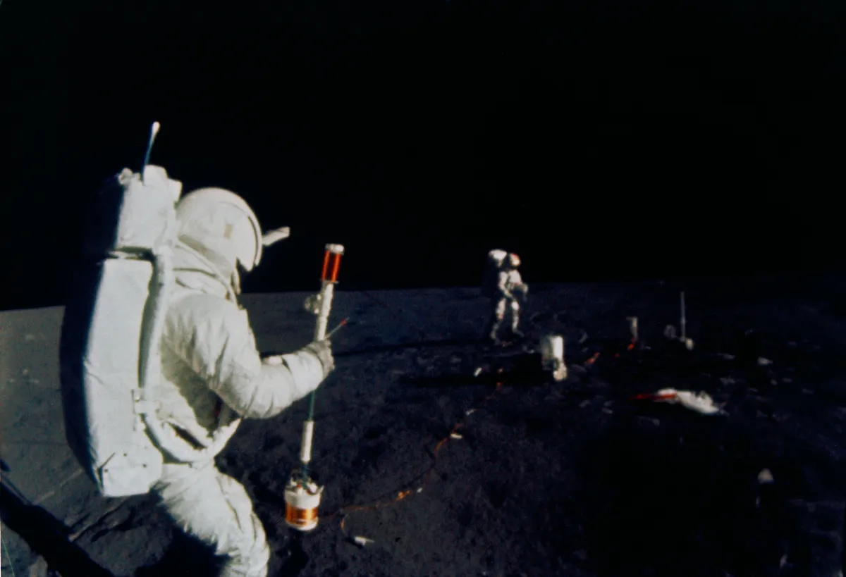 Apollo 14 lunar module pilot operating the Active Seismic Experiment (ASE) during the mission's first extravehicular activity on the Moon. Credit: NASA