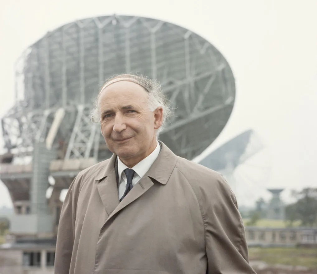 Sir Bernard Lovell pictured in from of the Lovell telescope at Jodrell Bank, circa 1964. Photo by Keystone/Hulton Archive/Getty Images