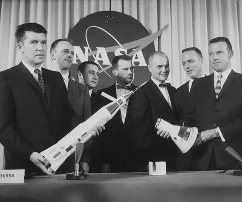 The Mercury 7 astronauts pose with a model rocket at a press conference in April 1959. Credit: NASA