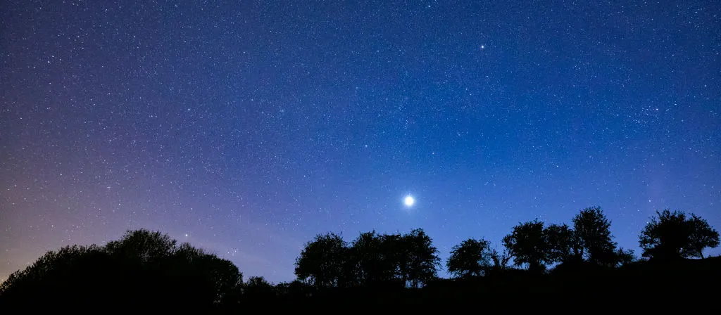 Venus and a starry night sky over the Cotswolds. Photo by Tim Graham/Getty Images