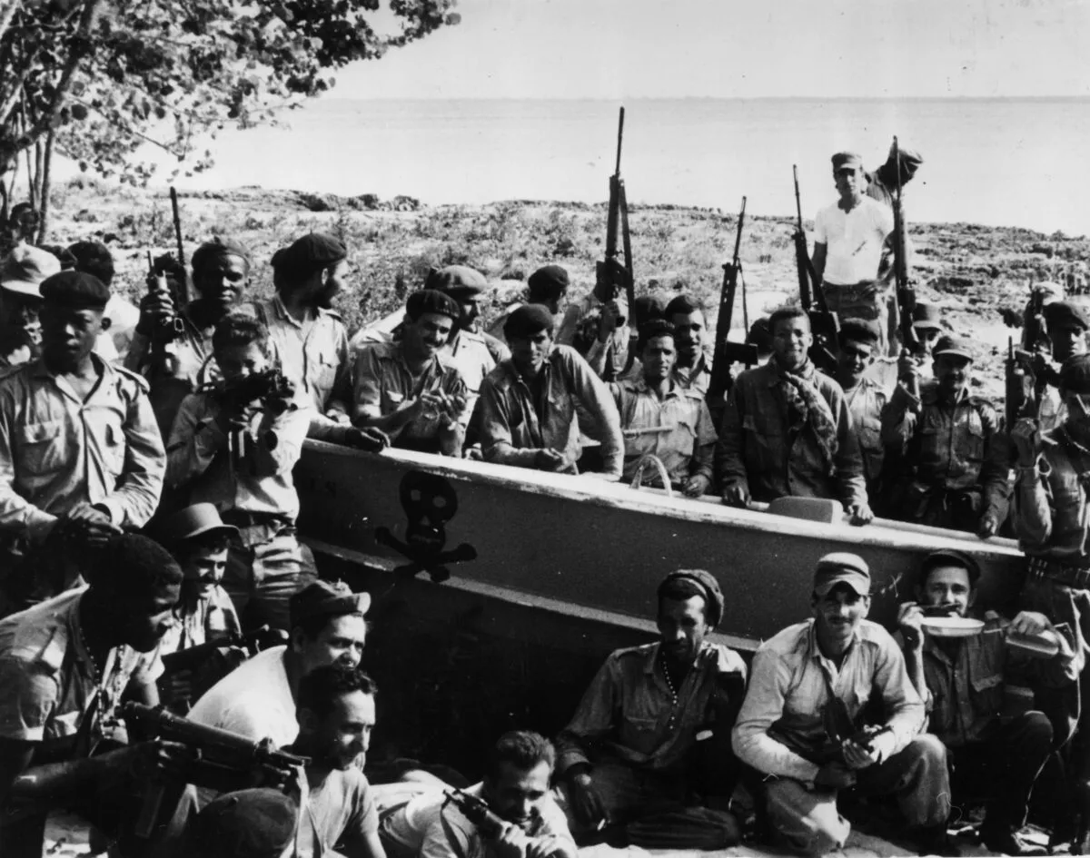 Cuban militia personnel and revolutionaries celebrate victory over US-backed mercenaries during the Bay of Pigs invasion. Credit: Keystone/Getty Images)