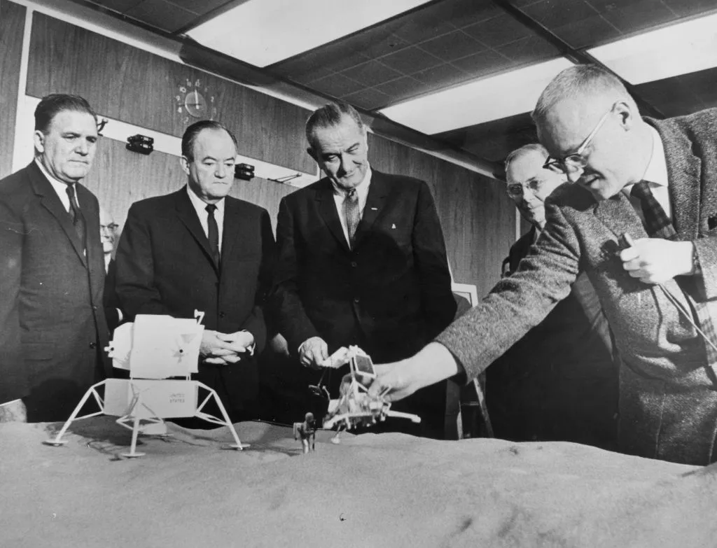 Left to right: NASA administrator James E Webb, US Vice President Hubert Humphrey, President Lyndon Johnson, Dr Hugh L Dryden and Dr Homer E Newell at a briefing on the US space programme at NASA, Washington, 1 March 1965. Photo by Central Press/Getty Images