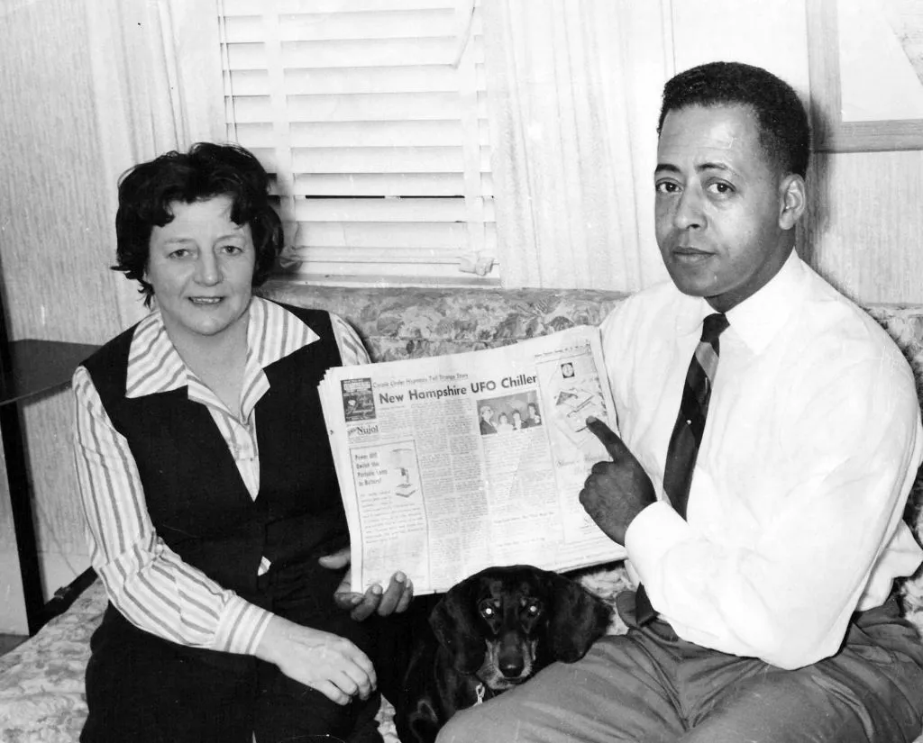 Betty and Barney Hill pictured with the newspaper reporting their UFO abduction story. Photo by: Universal History Archive/ Universal Images Group via Getty Images