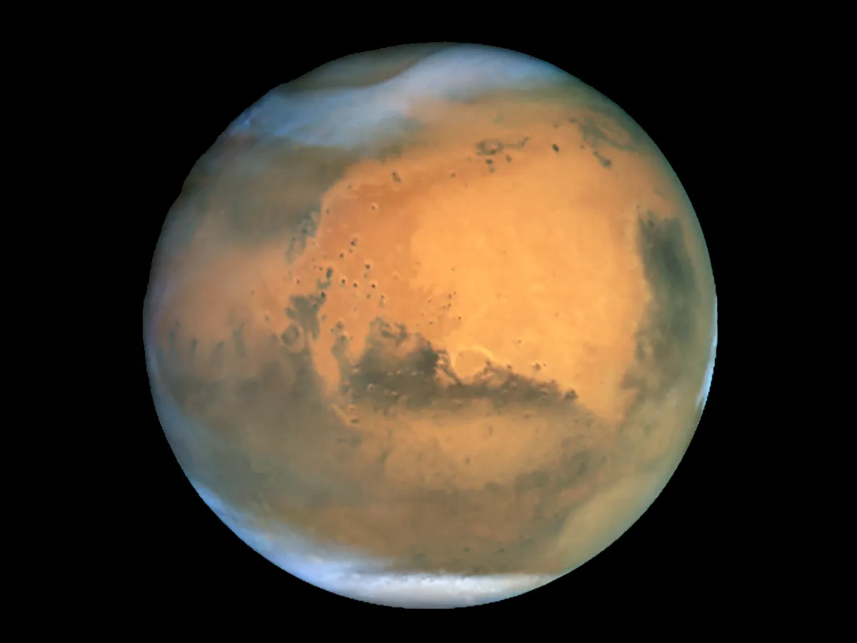 Mars, as seen by the Hubble Space Telescope. Acknowledgements: J. Bell (Cornell U.), P. James (U. Toledo), M. Wolff (Space Science Institute), A. Lubenow (STScI), J. Neubert (MIT/Cornell) Credit: NASA/ESA and The Hubble Heritage Team STScI/AURA