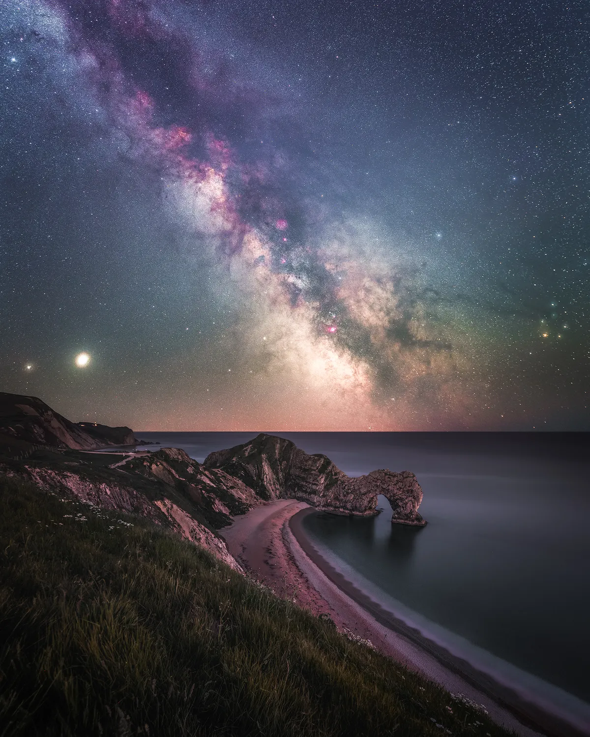 Milky Way rising over Durdle Door © Anthony Sullivan (UK) West Lulworth, Dorset, UK, 20 May 2020. Equipment: Canon 6D camera. Foreground: 20 mm f/8 lens, ISO 100, 244-second exposure. Sky: 20 mm f/4 lens, ISO 1600, 4 x 240-second exposures