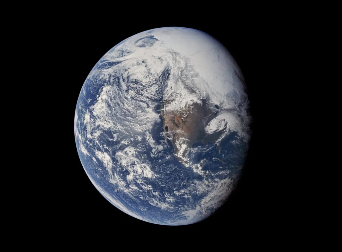 A remarkable view of Earth from Apollo 16, taken on 16 April 1972, reveals a world of blue and white with a hint of brown; (inset) the image before it was digitally restored. Credit: NASA / Toby Ord