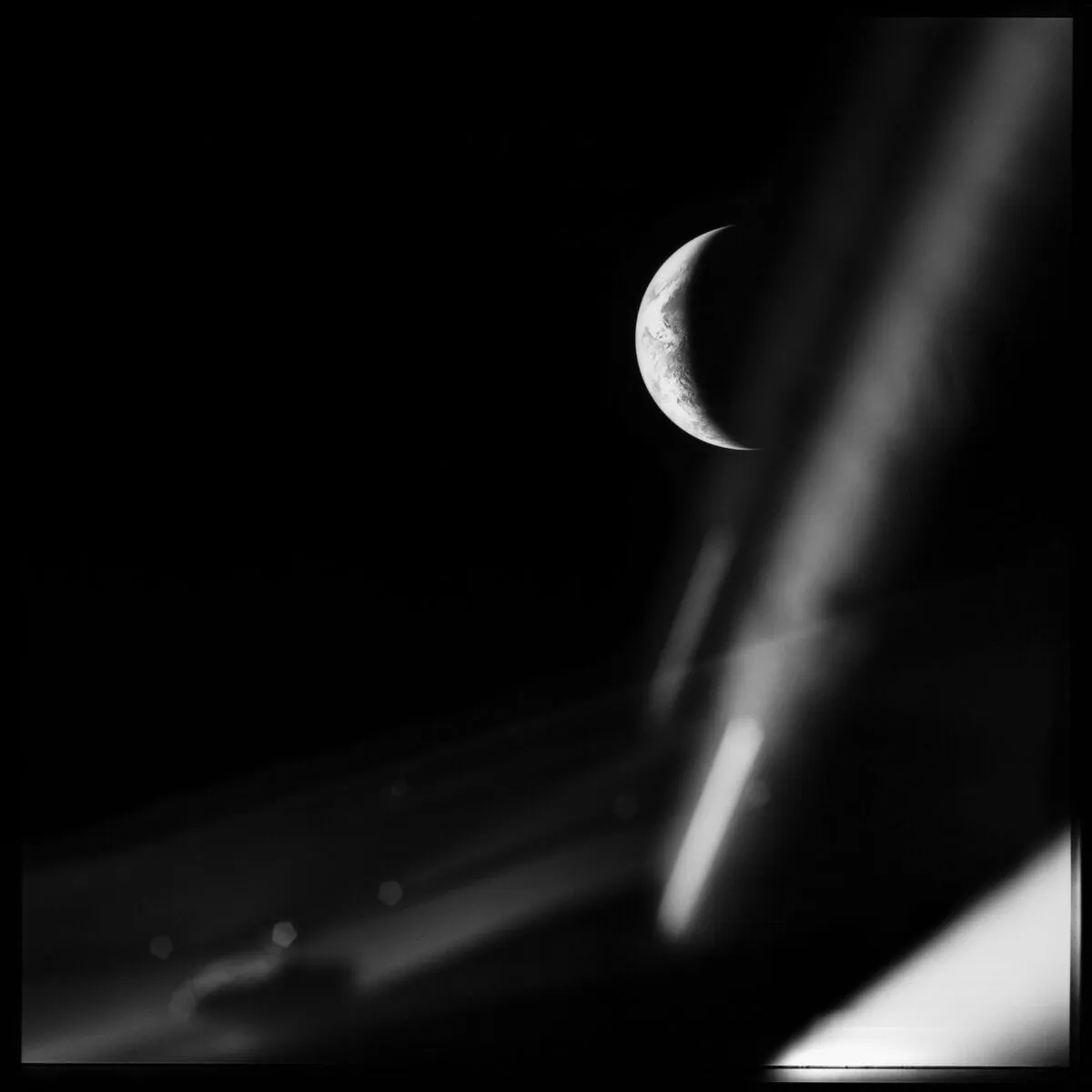 A haunting view of a crescent Earth taken from inside Apollo 13’s Lunar Module on 17 April 1970. Credit: NASA / restored by Toby Ord