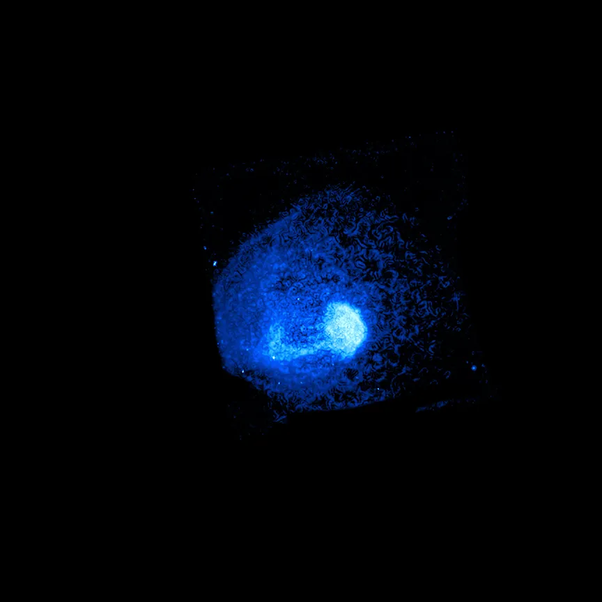 A clash of galaxy clusters creates a spiralling L-shaped plume in Abell 1775, CHANDRA X-RAY OBSERVATORY/ Pan-STARRS/LOFAR, 15 JULY 2021. Image credit: X-ray: NASA/CXC/Leiden Univ./A. Botteon et al.; Radio: LOFAR/ASTRON; Optical/IR:PanSTARRS