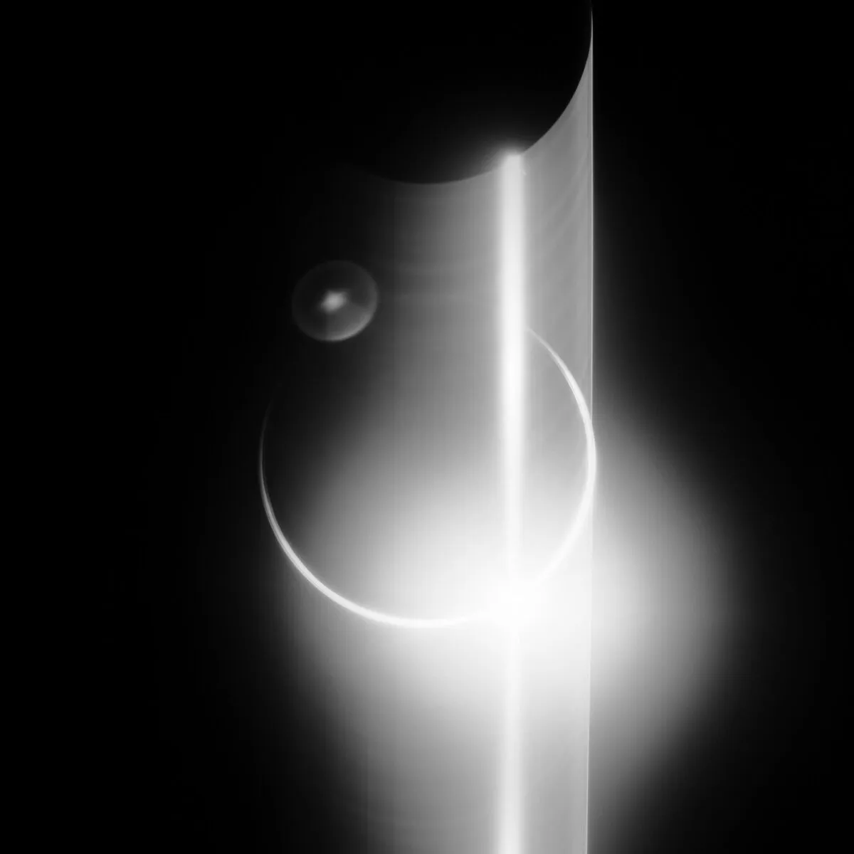 An attempt to capture a total eclipse of the Sun by the Earth with a long exposure during Apollo 12, 24 November 1969. A glowing ring of atmosphere can be seen around Earth, but the thin circle is blurred by hand shake and a camera malfunction has spread the light vertically across the image. Credit: NASA / restored by Toby Ord
