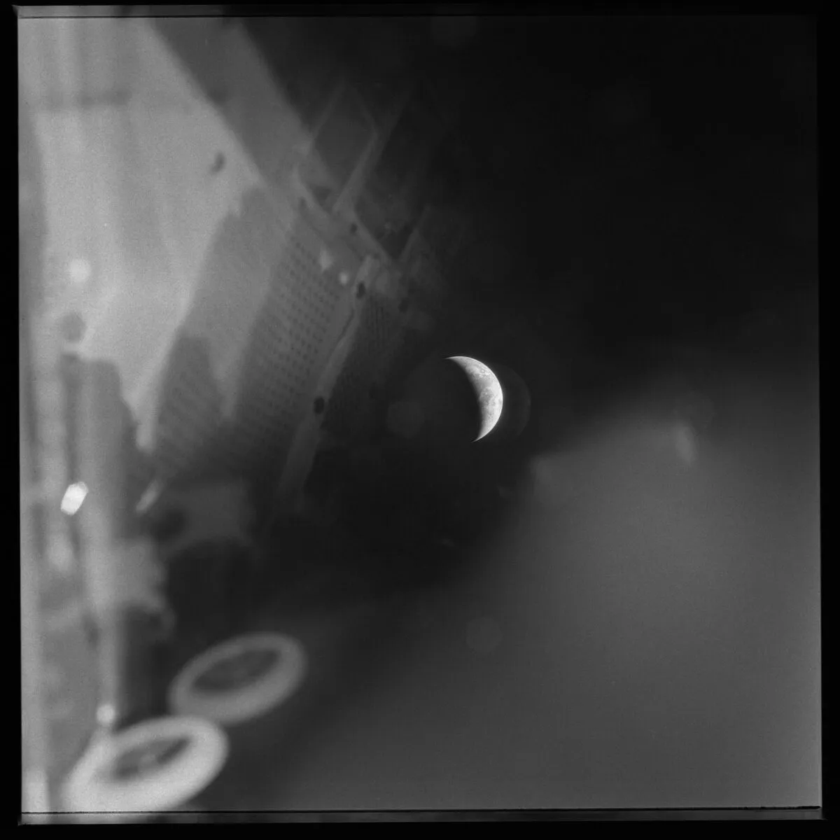 A crescent Earth surrounded by reflections of the Lunar Module during Apollo 13. The Lunar Module became the Apollo 13 astronauts' only hope of survival once the Command Module lost power. This image was captured 3 days after the explosion on 17 April 1970. Home must have seemed a very long way away. Credit: NASA / restored by Toby Ord