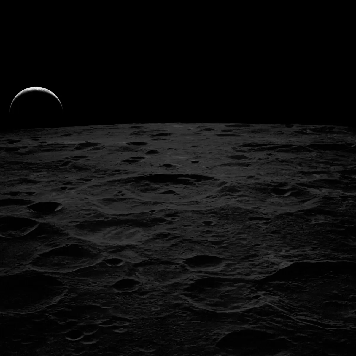A black and white earthrise captured during Apollo 14, 7 February 1971. When this image was taken, the astronauts were returning from the far side of the Moon on their journey home. Credit: NASA / restored by Toby Ord
