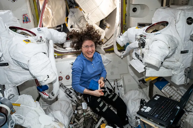 NASA astronaut Christina Koch preparing spacesuits inside the Quest joint airlock on the International Space Station. Credit: NASA