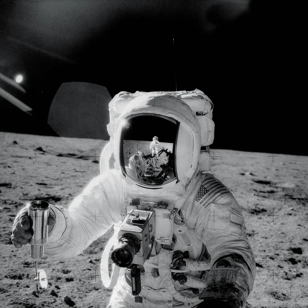 Apollo 12 astronaut Alan Bean pictured with a sample container filled with lunar soil. Apollo samples have helped scientists discover how the Moon did form. Credit: NASA