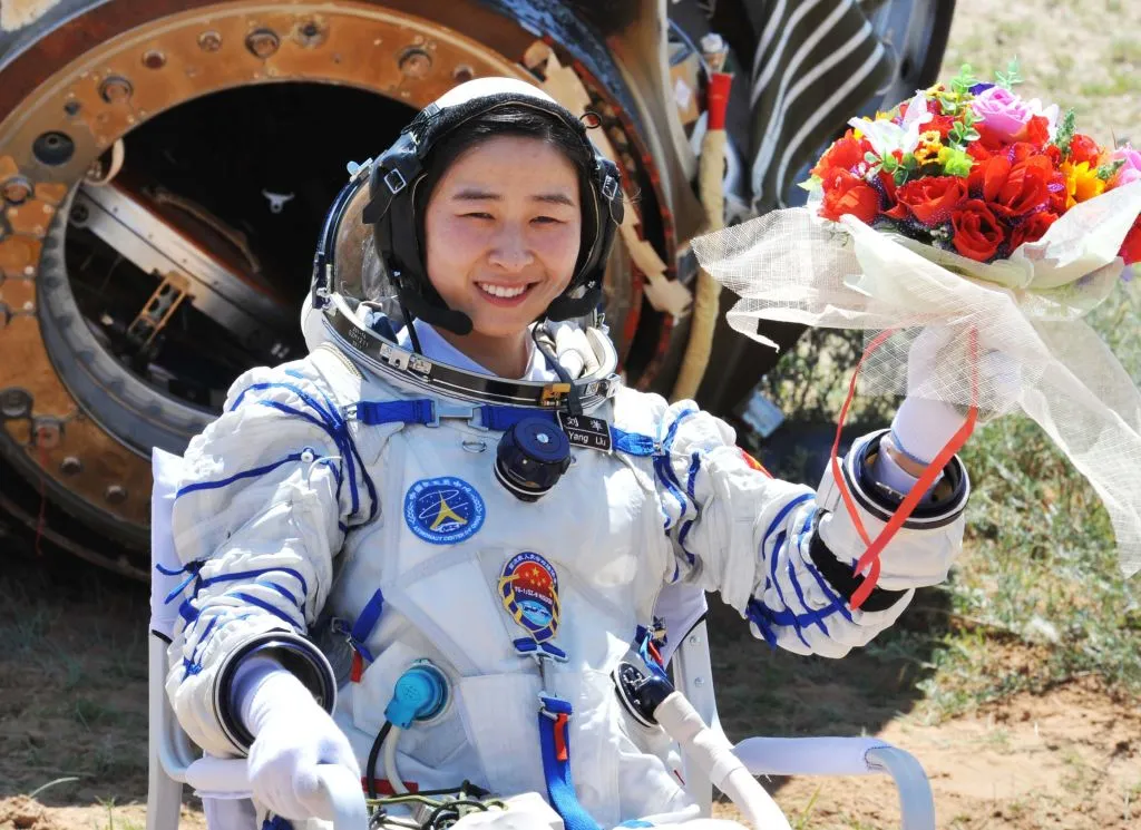 Chinese astronaut Liu Yang pictured after landing back on Earth in the Shenzhou-9 re-entry capsule, 29 June 2012. Photo by VCG/VCG via Getty Images.