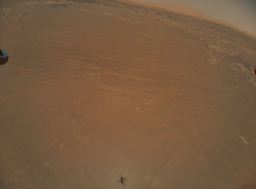 Ingenuity helicopter spots Perseverance from the air Perseverance Mars rover, 4 August 2021 IMAGE CREDIT: NASA/JPL-Caltech