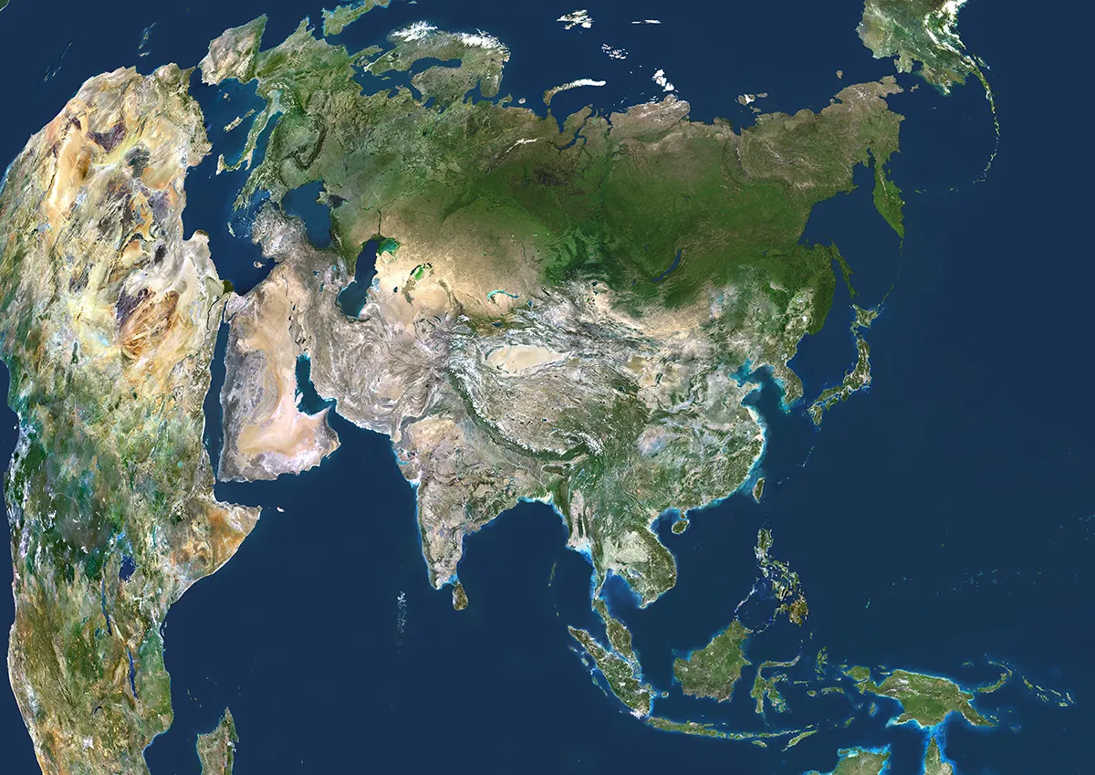 A satellite image of Earth showing Asia, Africa and Europe. The image differs from what we're used to seeing on maps because it faithfully shows Earth's curvature. Photo by Planet Observer/Universal Images Group via Getty Images.