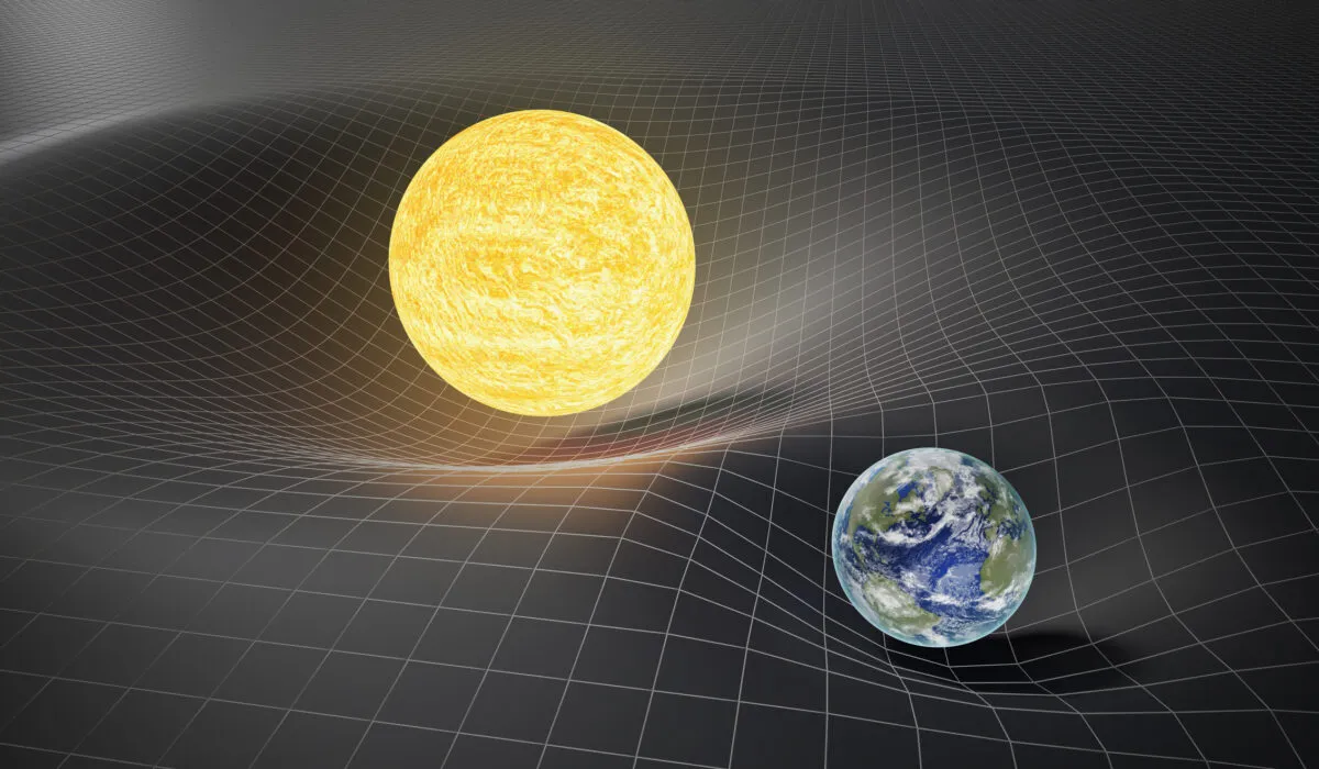Spacetime is curved by the mass of objects like the Sun and Earth. Credit: vchal / iStock / Getty Images Plus