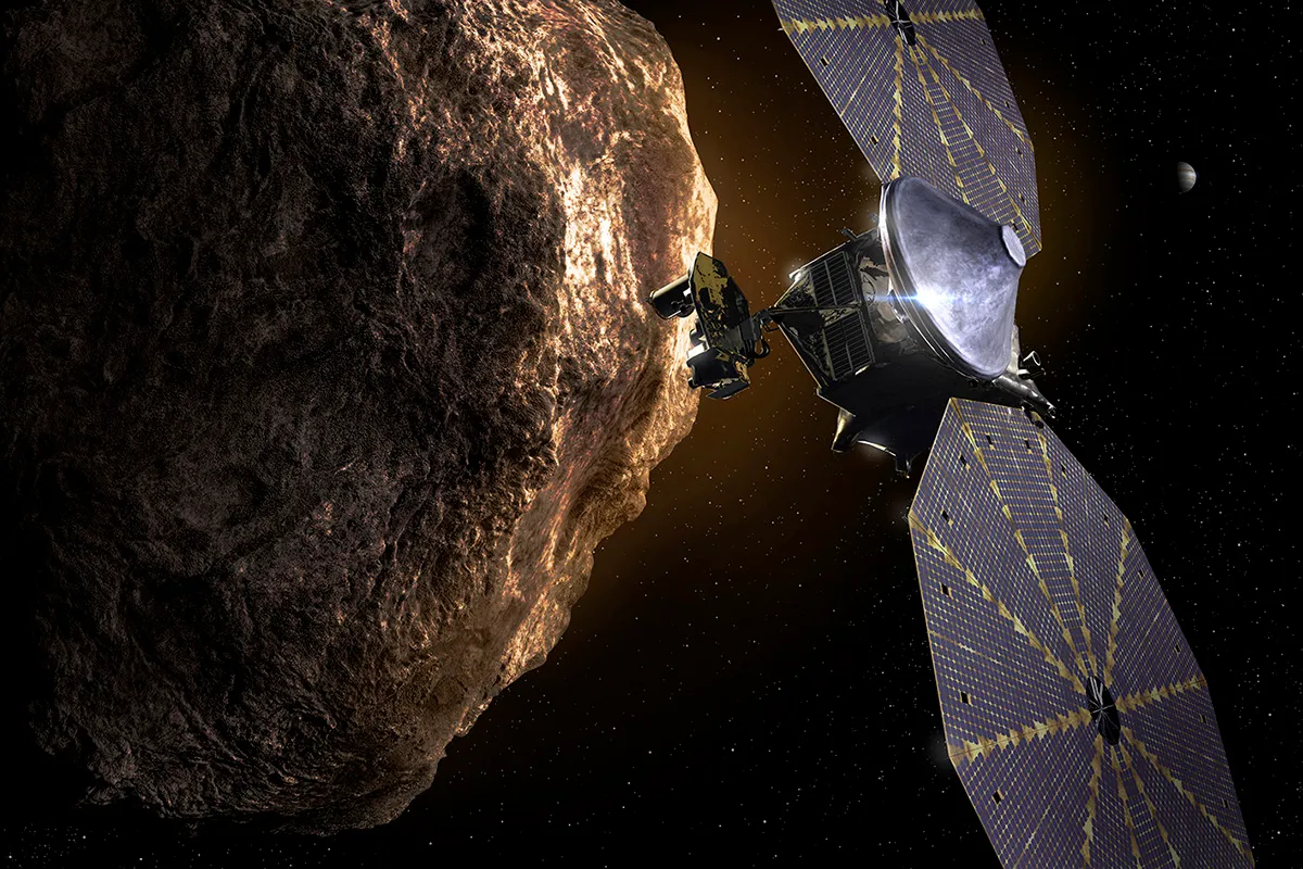 An artist's impression showing the Lucy spacecraft flying by one of Jupiter's Trojan Asteroids. Credit: Southwest Research Institute