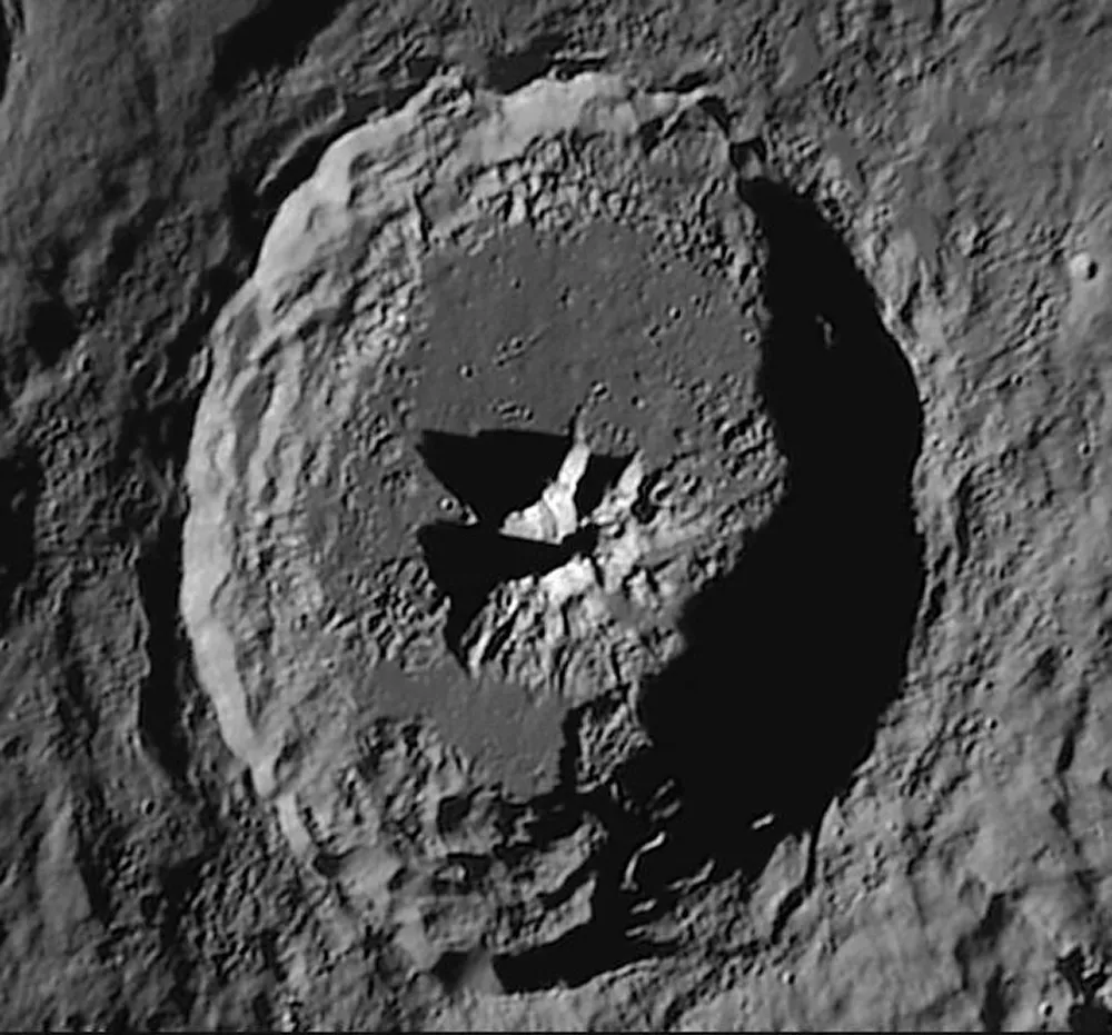 Lunar craters like Theophilus shown here, with clear wall shadows and an interesting central feature, make good examples for measuring physical heights. Credit: Alessandro Bianconi