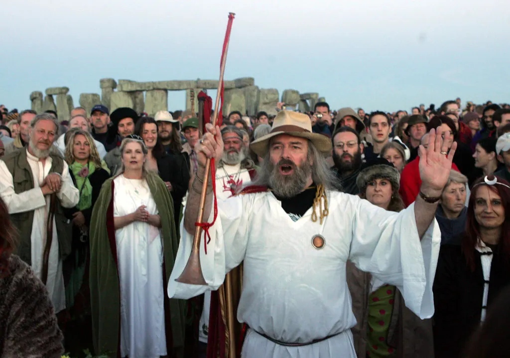 Druids celebrate the summer solstice at Stonehenge, 21 June 2005. Credit: Matt Cardy / Getty Images