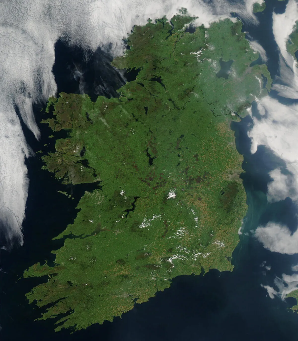 This image of Ireland was captured by the MODIS instrument onboard the Earth-orbiting Aqua satellite on 7 August 2003. The satellite's mission is to monitor natural systems on Earth and in the oceans, in order to better inform environmental protection. Easily discernable on the map is Dublin, the capital city of the Republic of Ireland, which can be seen about halfway down the east coast. Just south of the city, the light blue-green smudge in the Irish Sea is actually drifting phytoplankton. Credit: Jeff Schmaltz, MODIS Rapid Response Team, NASA/GSFC
