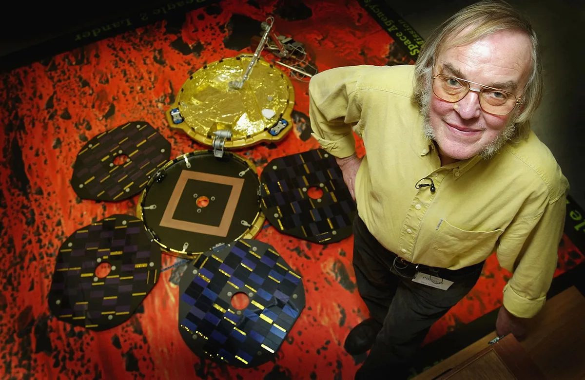 Beagle 2 lead scientist Colin Pillinger pictured with a model of Beagle 2 at the Lander Operations Planning Centre on 27 November 2003 in Milton Keynes, UK. Credit: Scott Barbour/Getty Images