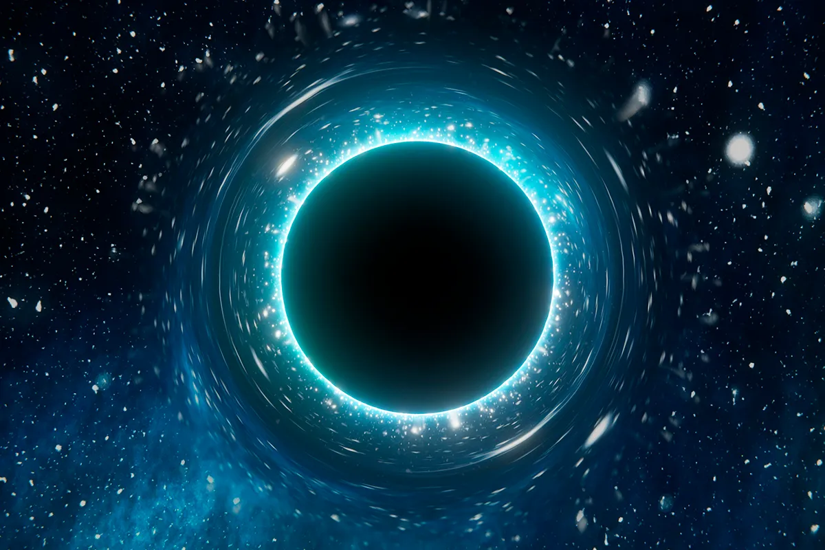 Artist’s impression of a black hole warping space-time. Could a black hole ever swallow planet Earth? Credit: VChan / iStock / Getty Images Plus