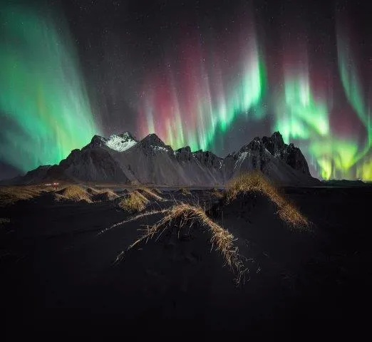 Spectrum, by Stefan Liebermann, Vestrahorn, Iceland. Category: Aurorae Equipment: Sony ILCE-7SM3 camera, 14 mm f/1.8, 2-second exposure. 