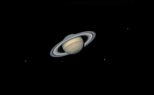 Saturn and its Moons by Flávio Fortunato, Maceió, Alagoas, Brazil. Category: Planets, Comets & Asteroids. Equipment: SVBONY SV305 camera, 1200 mm f/17, IR-cut filter, 0.02-second exposure.