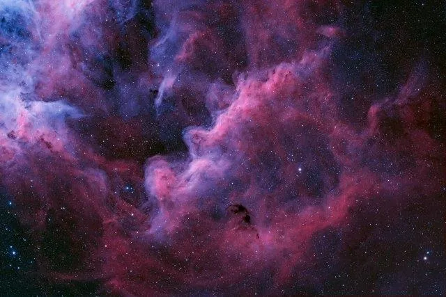 Suburbs of Carina Nebula by Ignacio Diaz Bobillo, General Pacheco, Buenos Aires Province, Argentina. Category: Stars & Nebulae. Equipment: QHY 600 camera, 1252mm f/7.2, 54 x 5-minute exposures in H-alpha and 61 x 5-min exposures in OIII (5 hours 24 minutes total exposure).
