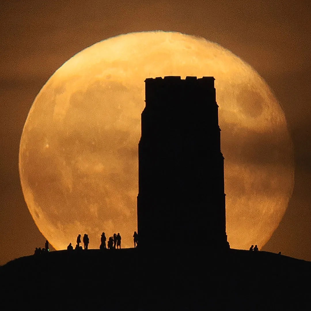 Equinox Moon and Glastonbury Tor © Hannah Rochford, Glastonbury, Somerset, UK, September 2021. Highly Commended, People & Space, APY 14. Equipment: Sigma 150–600 mm telescope, SLIK tripod, Canon EOS 5D Mark II camera, 600 mm f/6.37, 1/8-second exposure 
