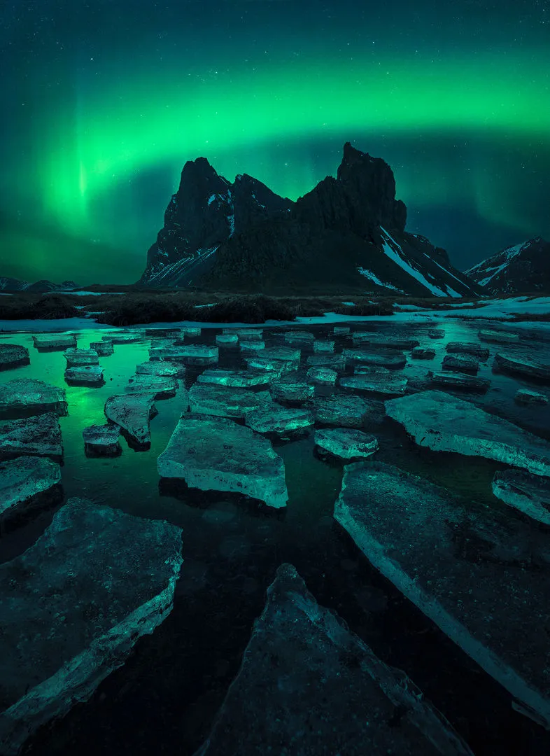 In the Embrace of a Green Lady © Filip Hrebenda, Hvalnes, Iceland, 10 April 2021. Winner, Aurorae, APY 14. Equipment: Sony ILCE-7RM3A camera, 16 mm f/2.8, ISO 2500 Sky: 5-second exposure Foreground: 20-second exposure 