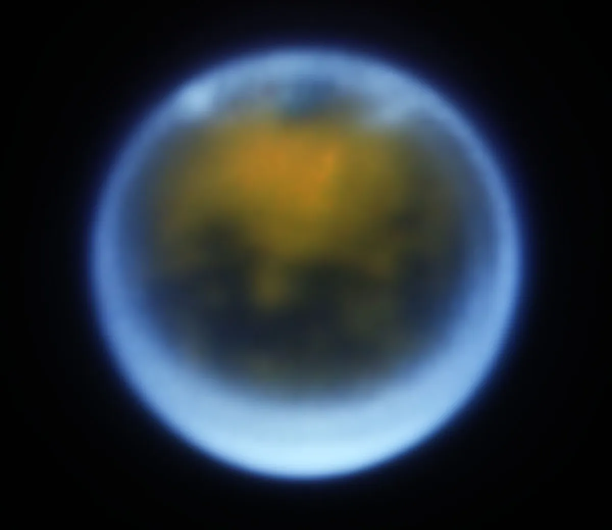Credit: W. M. Keck Observatory/Judy Schmidt Clouds in the atmosphere of Saturn’s moon Titan Keck II Telescope, 1 December 2022