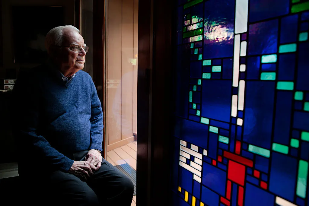 Dr. Frank Drake next to a stained glass window with the Arecibo Message at his home in Aptos, California, 27 February 2015. Photo by Ramin Rahimian for The Washington Post via Getty Images