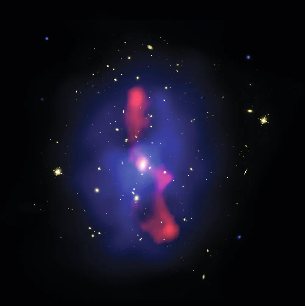 2 November 2006 Three views of this galaxy cluster make up this image: Hubble’s show the galaxies in yellow, Chandra’s show X-ray-emitting hot gas in blue, which has been pushed aside by jets of high-energy particles from a black hole imaged by the Very Large Array in red.
