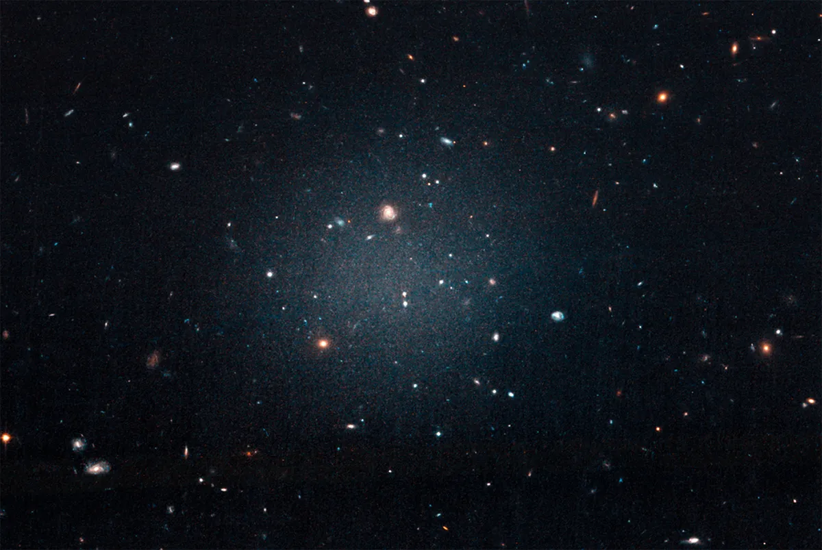 Hubble Space Telescope image of diffuse galaxy NGC 1052-DF2, a galaxy that's missing most, if not all, of its dark matter. Credit: NASA, ESA, and P. van Dokkum (Yale University)