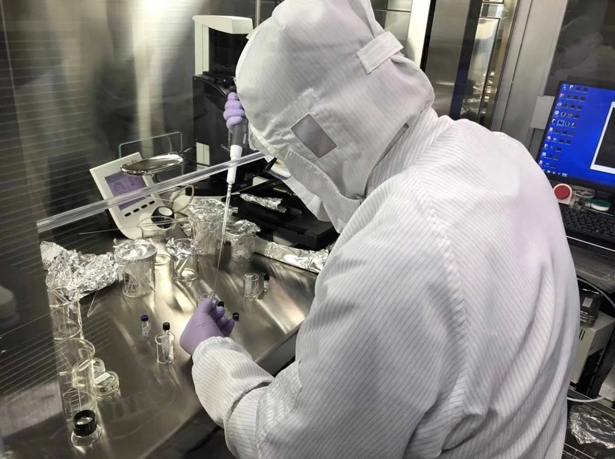 Solvent extractions of the Ryugu samples on a clean bench inside a clean room performed by Hiroshi Naraoka at Kyushu University in Japan. Credit: JAXA