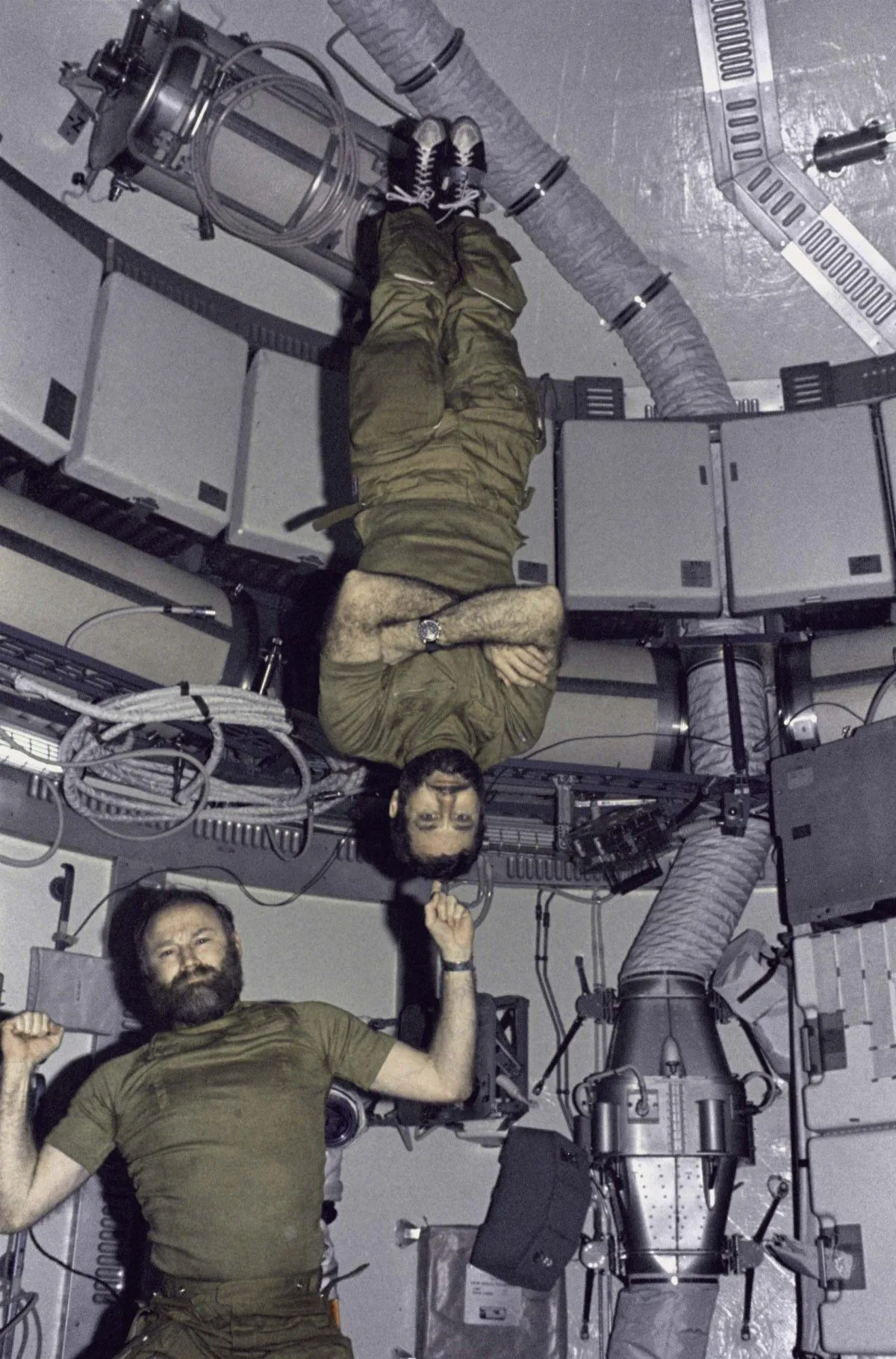 Skylab 4 commander Gerald Carr balances fellow astronaut William Pogue, the mission's pilot, upside down on his finger. Credit: NASA
