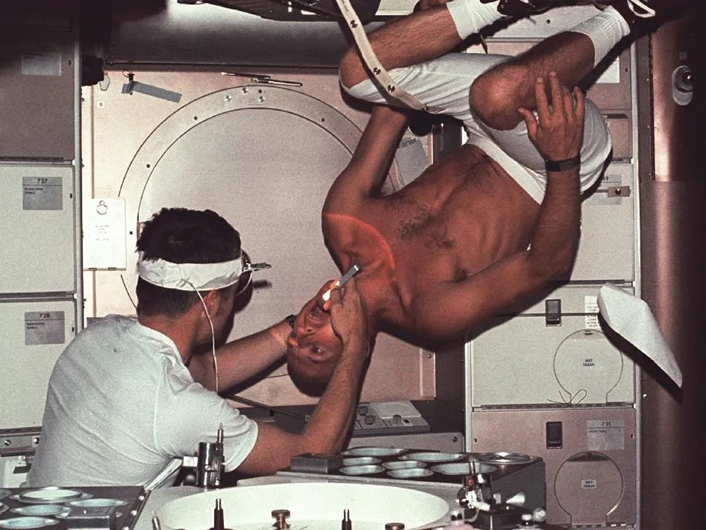Pete Conrad undergoes a physical examination during Skylab 2. A key science priority for Skylab was collecting data on the effects of long-duration spaceflight. Credit: NASA/MSFC
