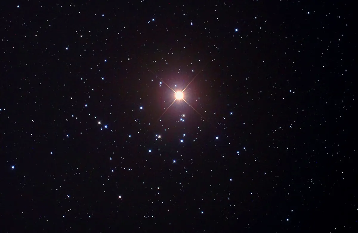 Mars passing across the Beehive Cluster in October 2011, imaged through a f/3.3 reflector. Credit: Pete Lawrence