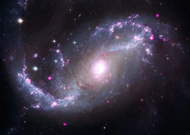 Barred spiral galaxy NGC 1672, as seen by the Chandra X-ray Observatory and the James Webb Space Telescope. Credit: X-ray: Chandra: NASA/CXC/SAO, XMM: ESA/XMM-Newton; IR: JWST: NASA/ESA/CSA/STScI, Spitzer: NASA/JPL-Caltech; Optical: Hubble: NASA/ESA/STScI, ESO. Image Processing: L. Frattare, J. Major, and K. Arcand.