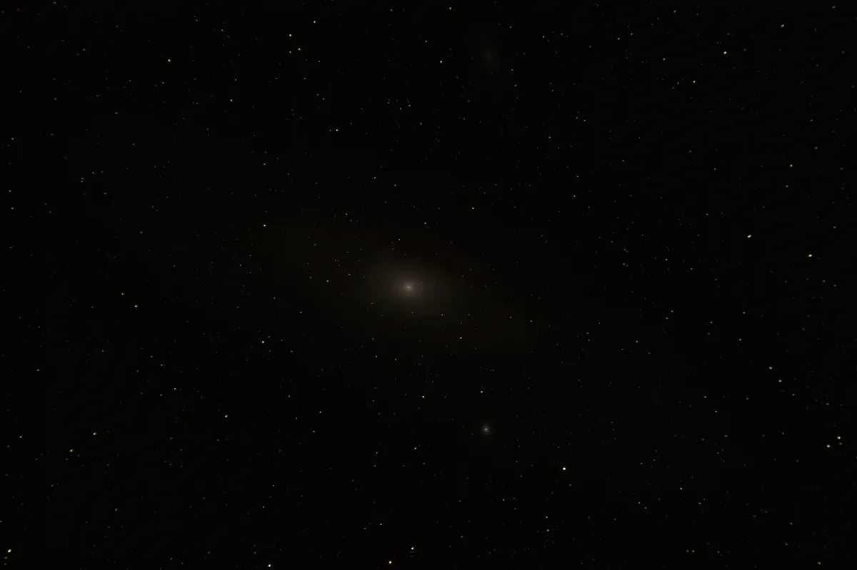 Our original stacked image, with the Andromeda Galaxy, M31 looking no more than a dark smudge.