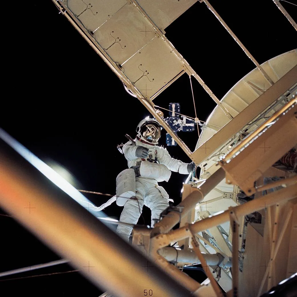 Astronaut Owen Garriott retrieves an image experiment from the Apollo Telescope Mount during a spacewalk on the second crewed Skylab mission. Credit: NASA